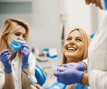 Woman smiling at Lighthouse Dental Clinic in Arlington, VA, showcasing Arlington general dentistry